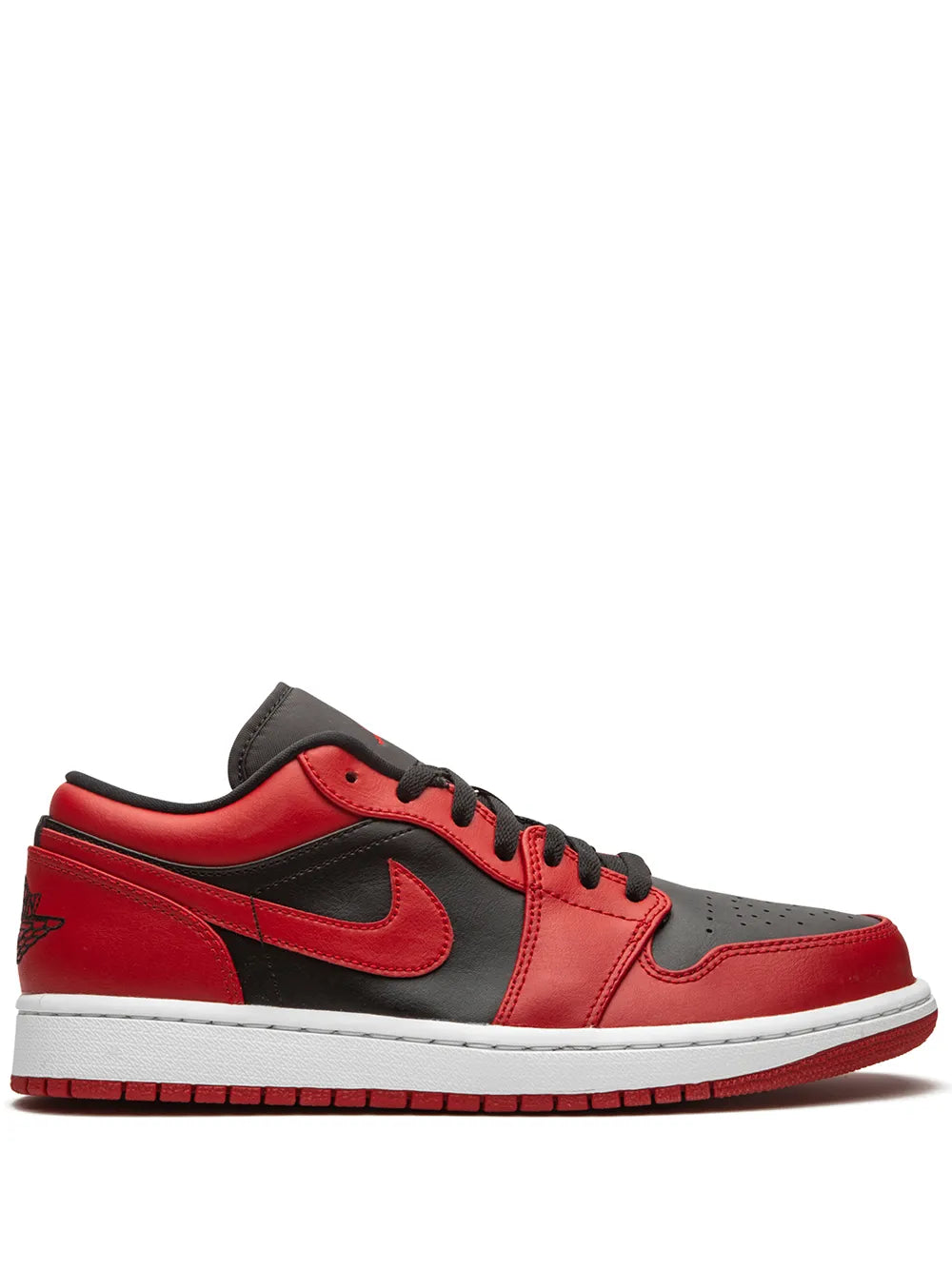Red low-top sneakers with black Swoosh, black collar, and white rubber sole
