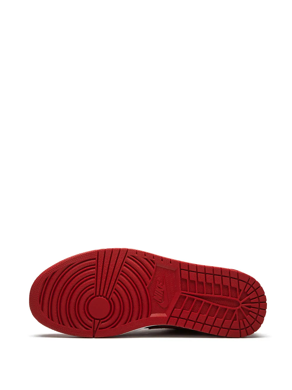 Red sneaker outsole with textured tread and circular pivot design