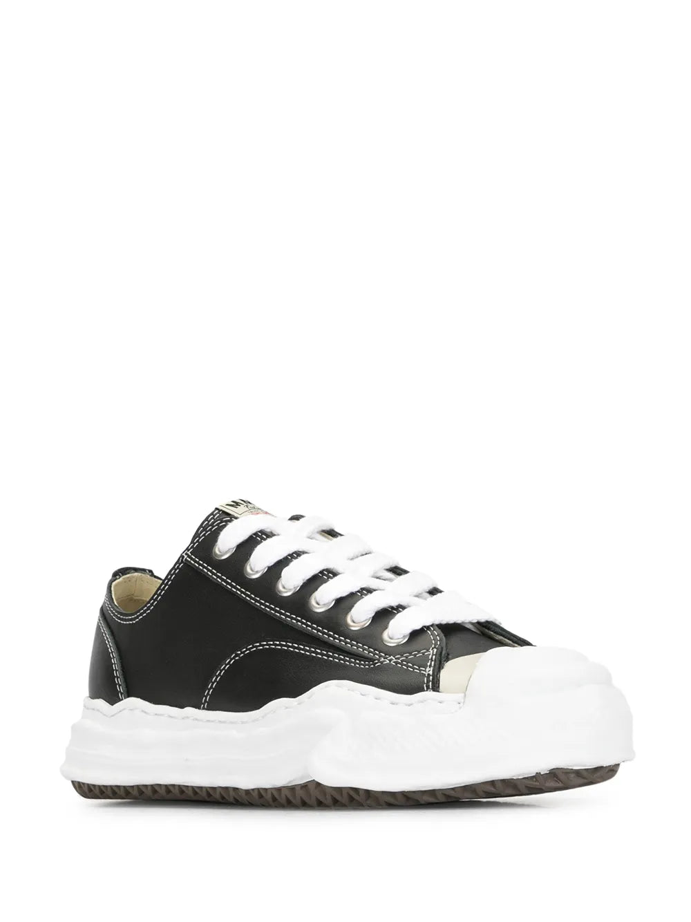 Black low-top lace-up sneakers with white laces and thick white rubber sole