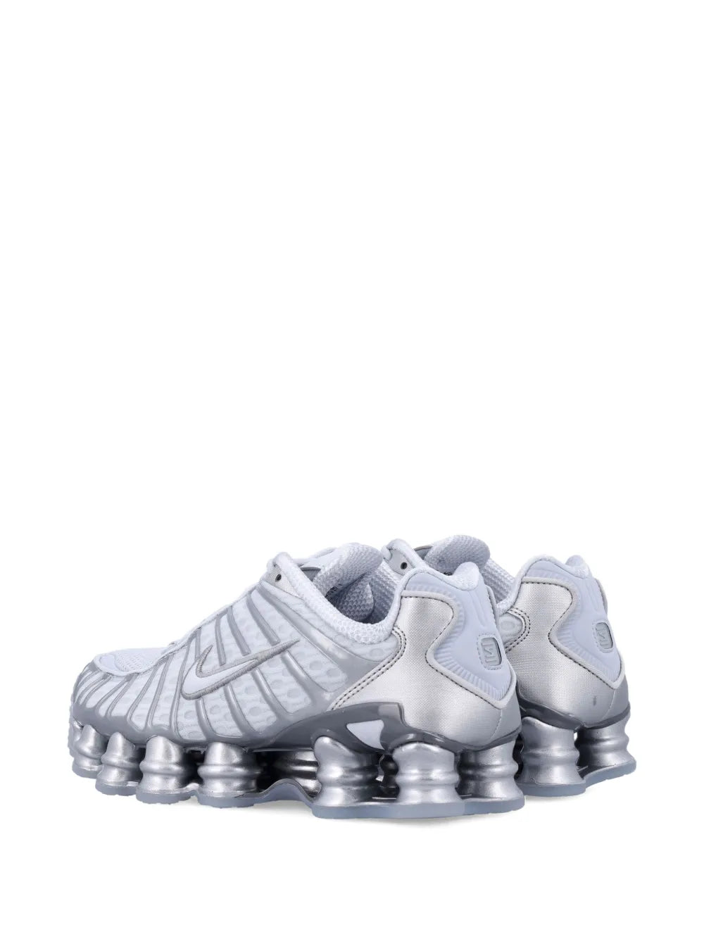 Light gray low-top sneakers with padded collar, Nike logo, and silver pod heel