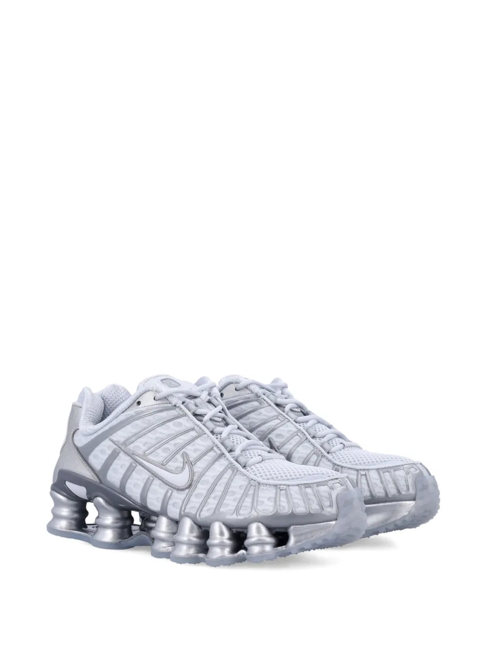 Light gray low-top sneakers, lace-up, with Nike logo and silver pod sole