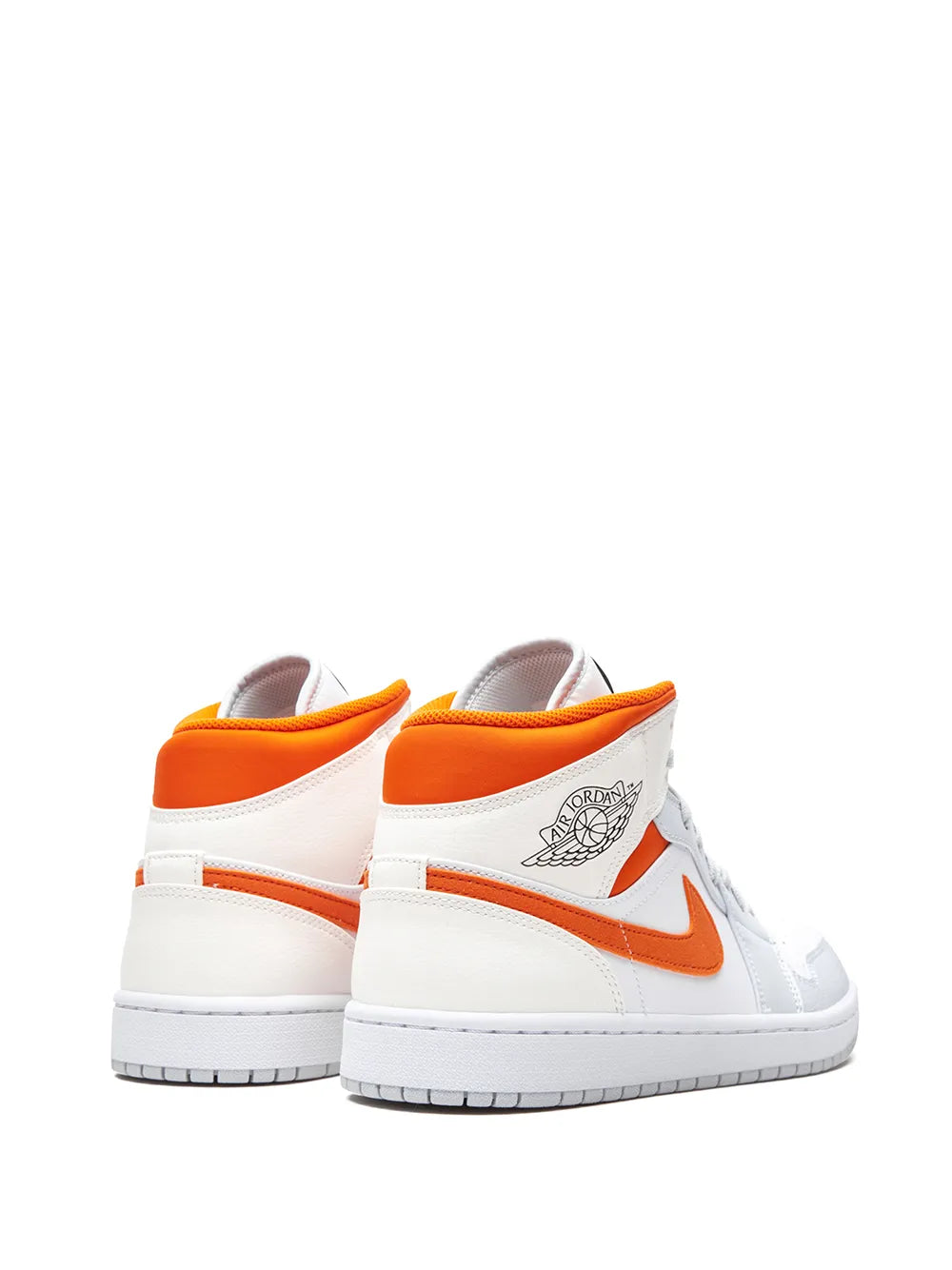 Pair of white mid-top sneakers with orange heel tab and orange swoosh