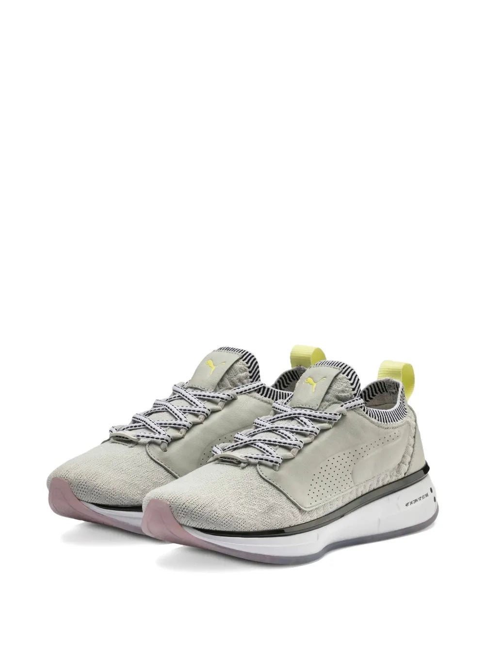 Pair of grey lace-up sneakers with knit collar, lime green heel tabs, and chunky sole