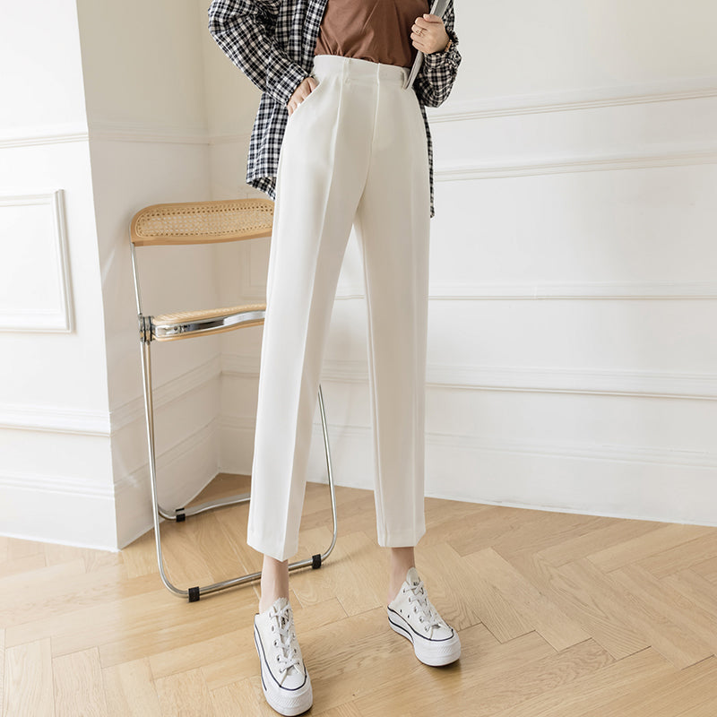 White casual pipe pants with pleated front, straight legs, button waist, belt loops
