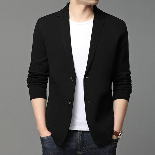 Mens black blazer with notched lapels, two-button front, front pockets, worn over white tee