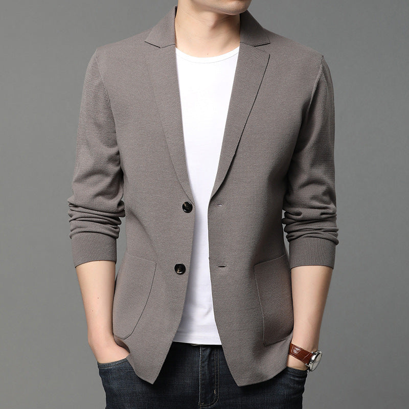 Mens gray blazer with notched lapels, two-button front, front pockets, worn over white tee