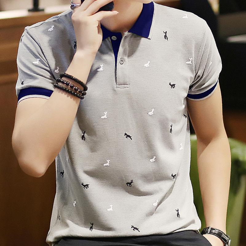Light gray polo shirt with navy collar and scattered animal graphic print.