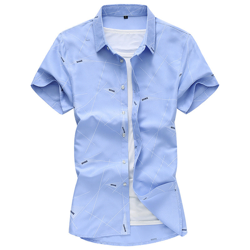 Men's dress shirt in light blue with geometric line print and spread collar