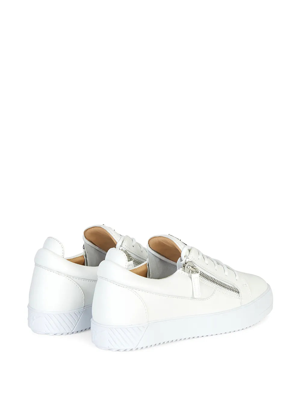 Pair of white low-top sneakers with double zippers, white laces, and cushioned sole