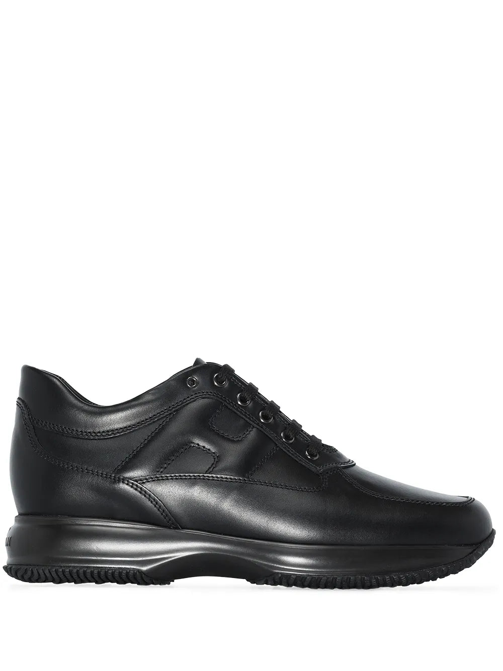Black low-top sneakers with lace-up closure and cushioned rubber sole
