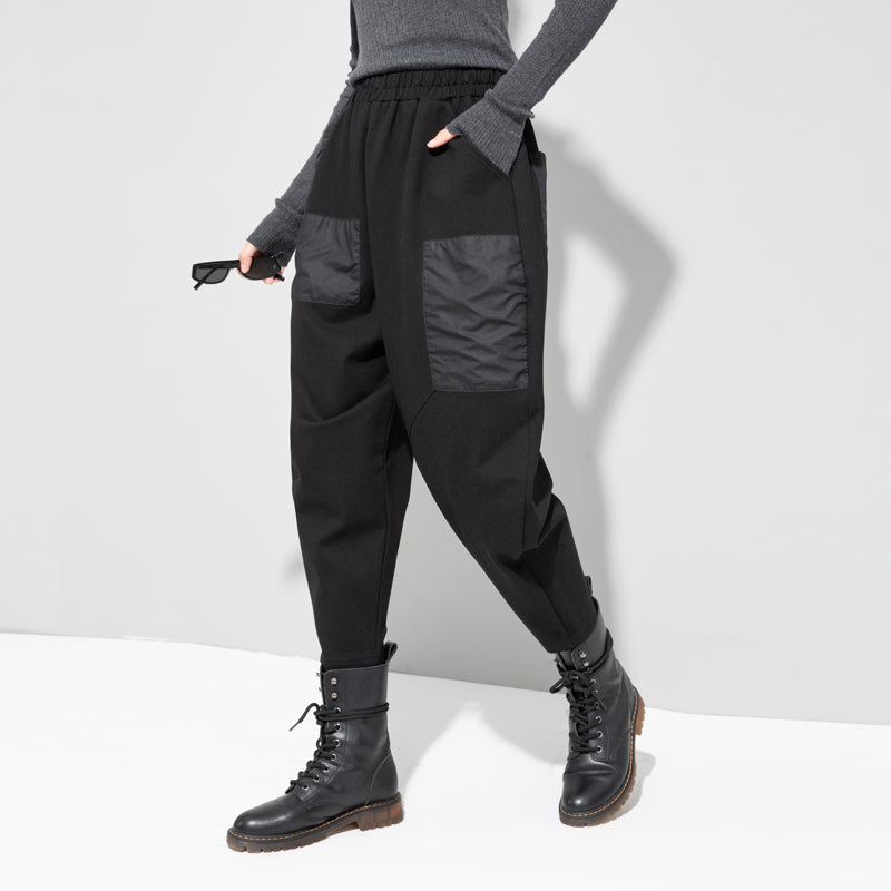 Black cropped loose pants with side cargo pocket, gathered elastic waist, cuffed hem