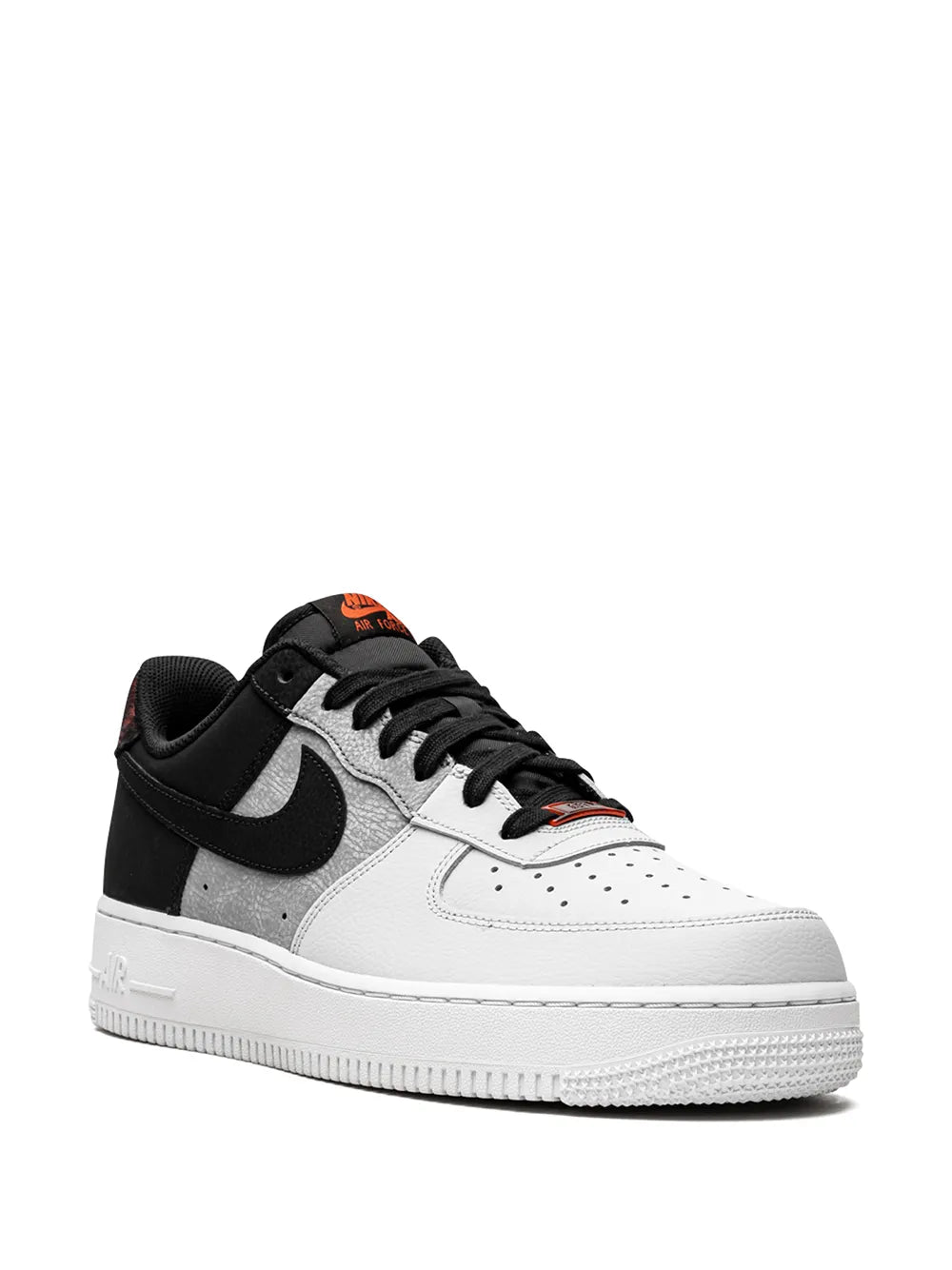 Nike Air Force 1 low-top sneakers, black and white with gray overlays and orange tongue detail