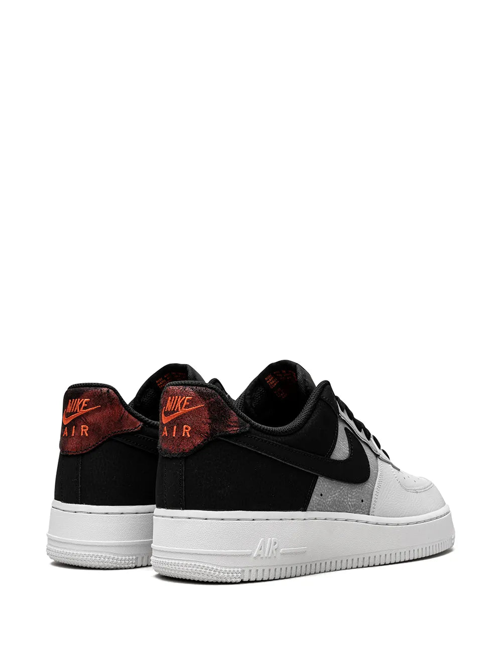 Nike Air Force 1 low-top sneakers, pair view with black uppers, gray swoosh, white midsoles