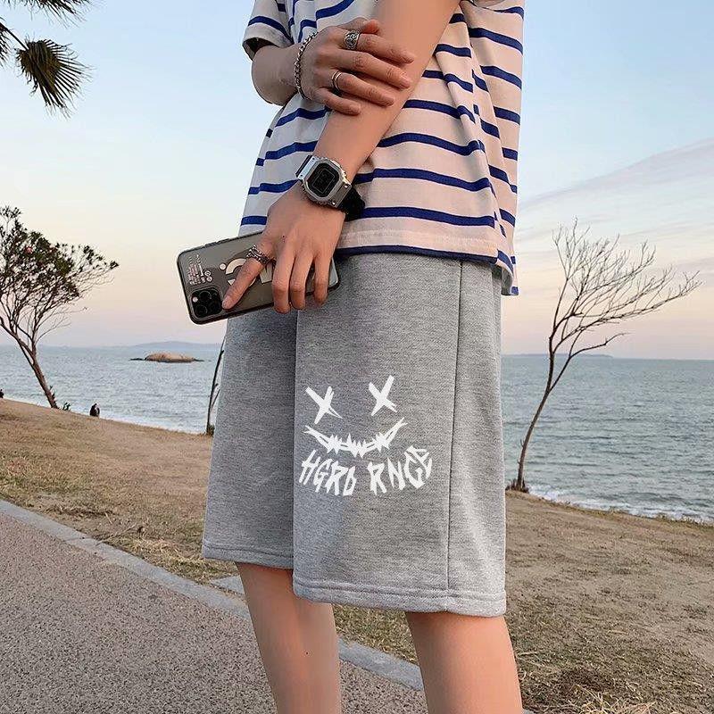 Gray straight sports shorts with white skull-motif graphic and stylized text