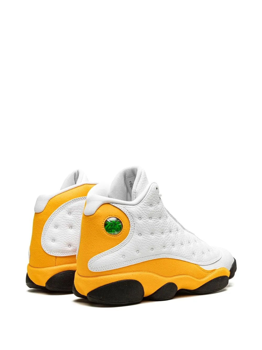 White and yellow Air Jordan 13 sneakers with green lace eyelet detail