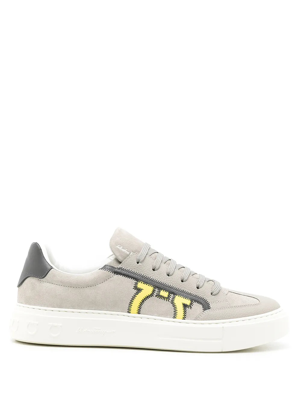 Ferragamo light gray low-top sneakers with yellow logo stripe, black heel tab, white sole