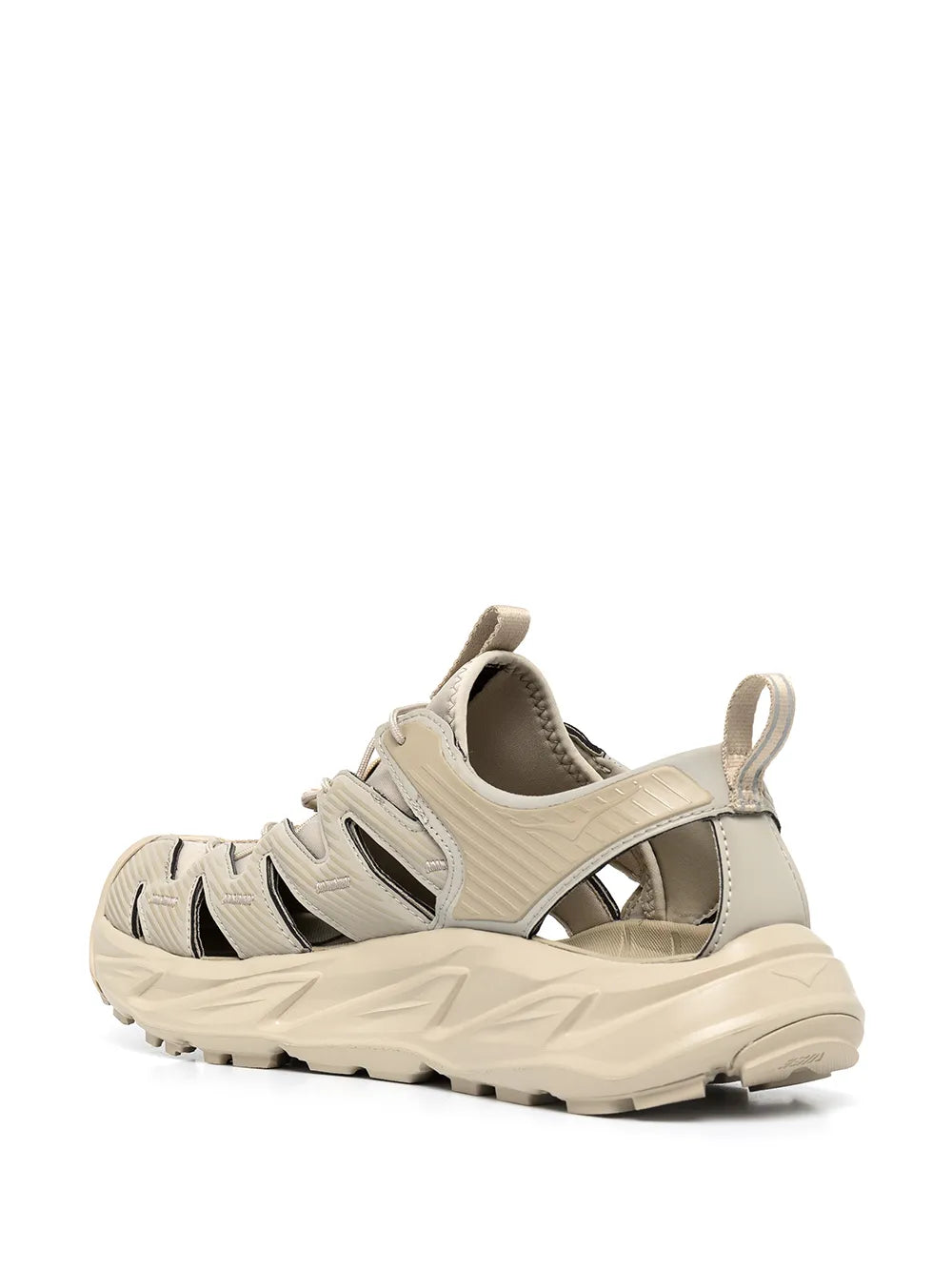 Beige lace-up low-top sneakers with black side stripes and padded collar
