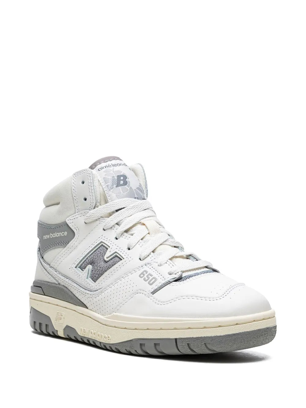 New Balance 650R sneakers, side view in white with gray logo and gum sole
