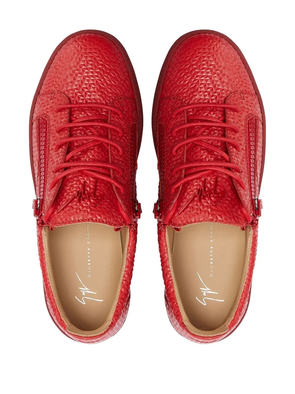 Red lace-up low-top sneakers with side zips and textured uppers