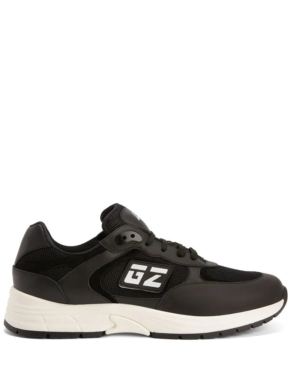Black low-top sneakers with GZ logo on side and cushioned white rubber sole