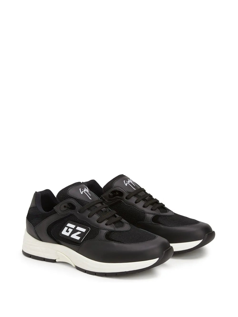Black low-top sneakers, side profile with GZ emblem and white midsole