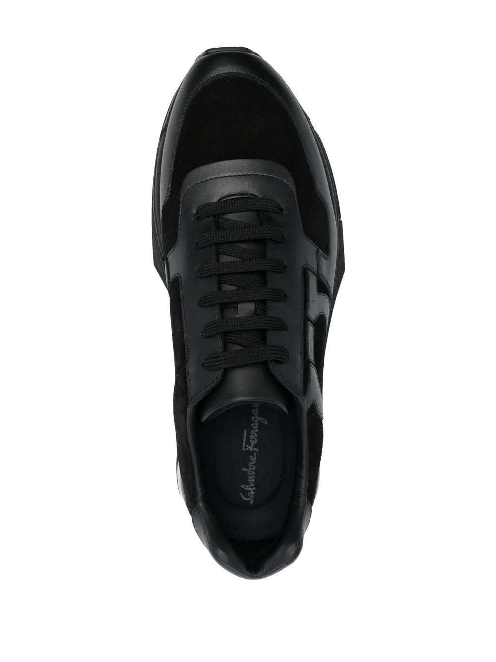 Black lace-up sneaker with black laces and Ferragamo logo on tongue