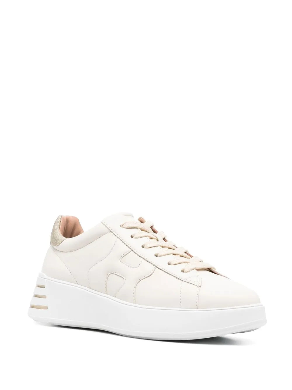 White leather low-top sneakers with metallic striped sole trim and lace-up