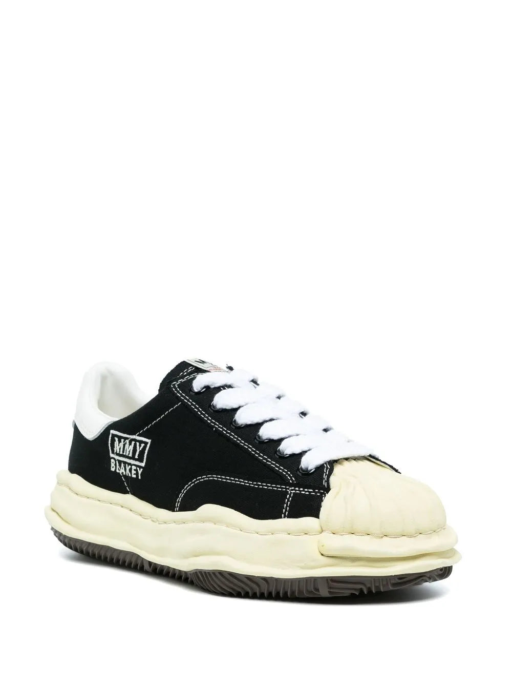 Black low-top sneakers with white laces, MMY Blakey logo, gum-rubber sole