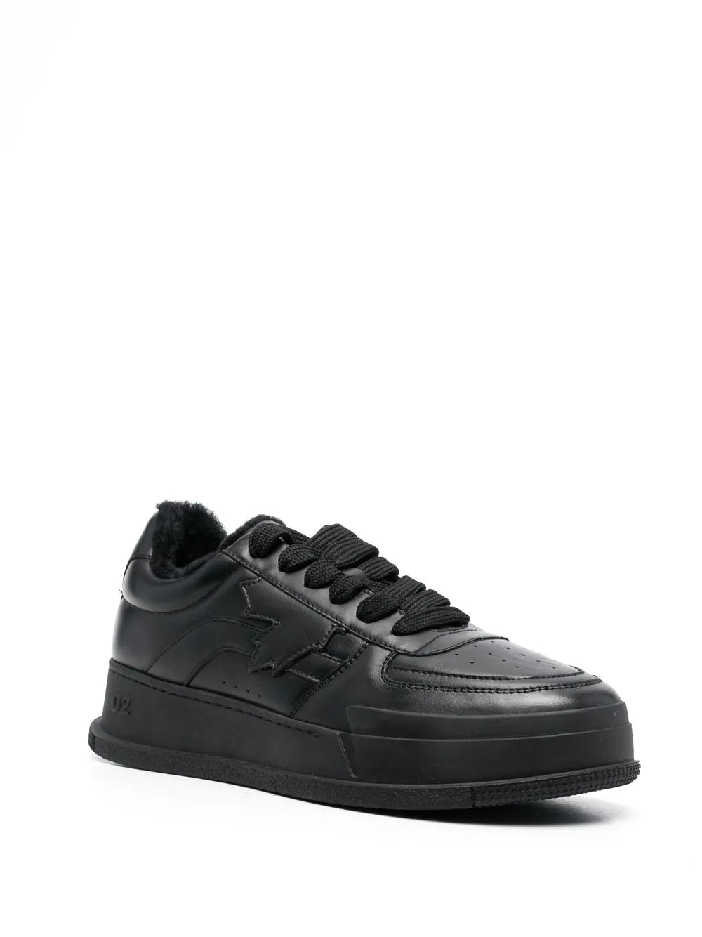 Black chunky low-top lace-up sneakers with textured overlays and side slash logo
