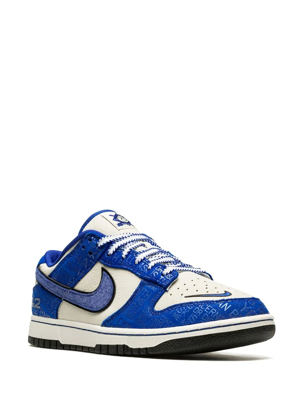 Blue and cream low-top sneakers with oversized Nike swoosh and lace-up design