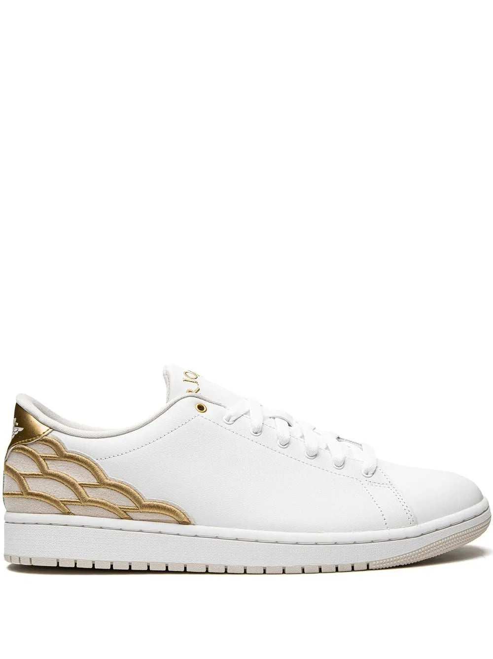 White low-top sneakers with gold wave side panels and lace-up front