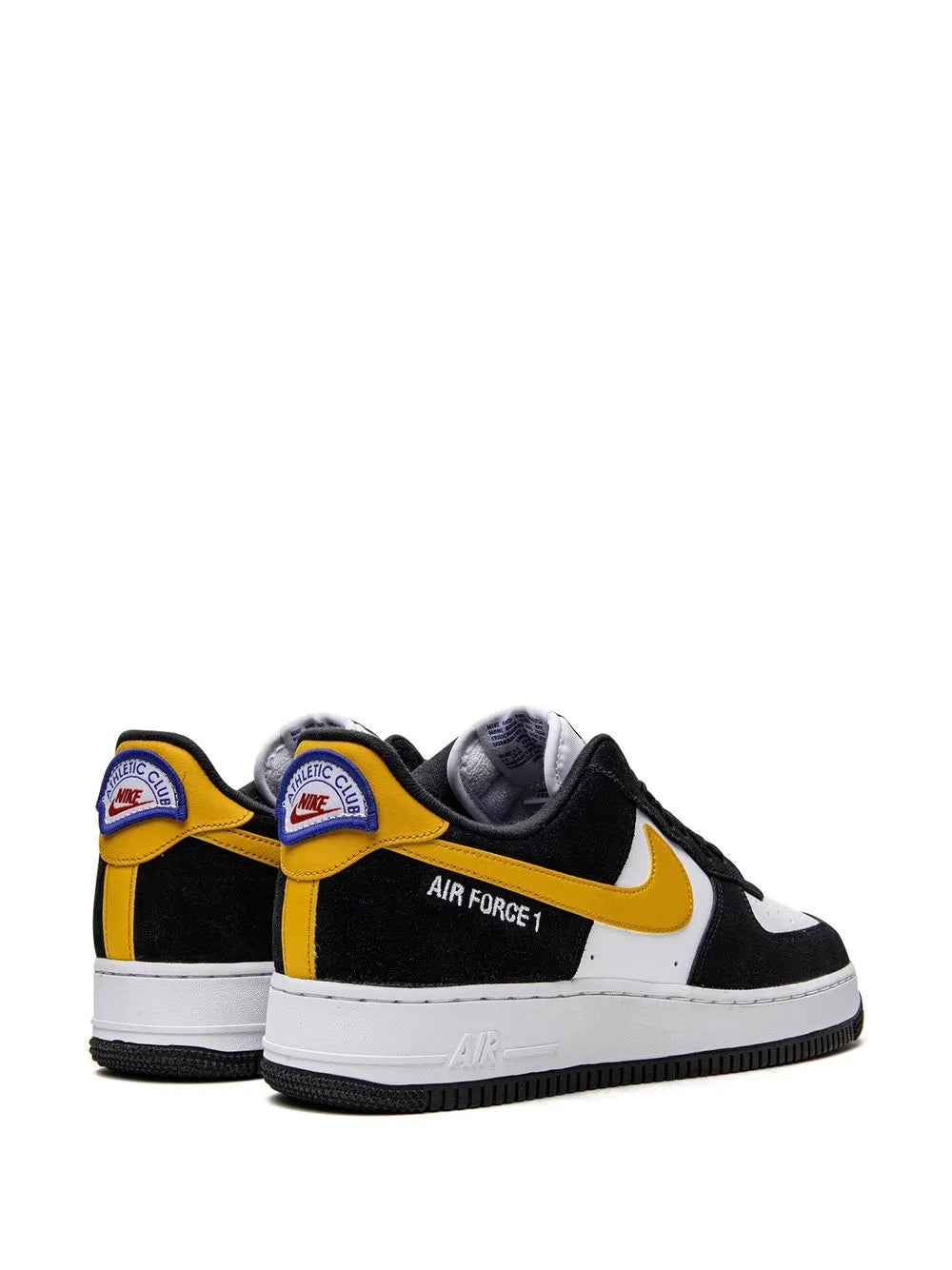 Nike Air Force 1 low-top sneakers pair, black and white with yellow swoosh, heel logos