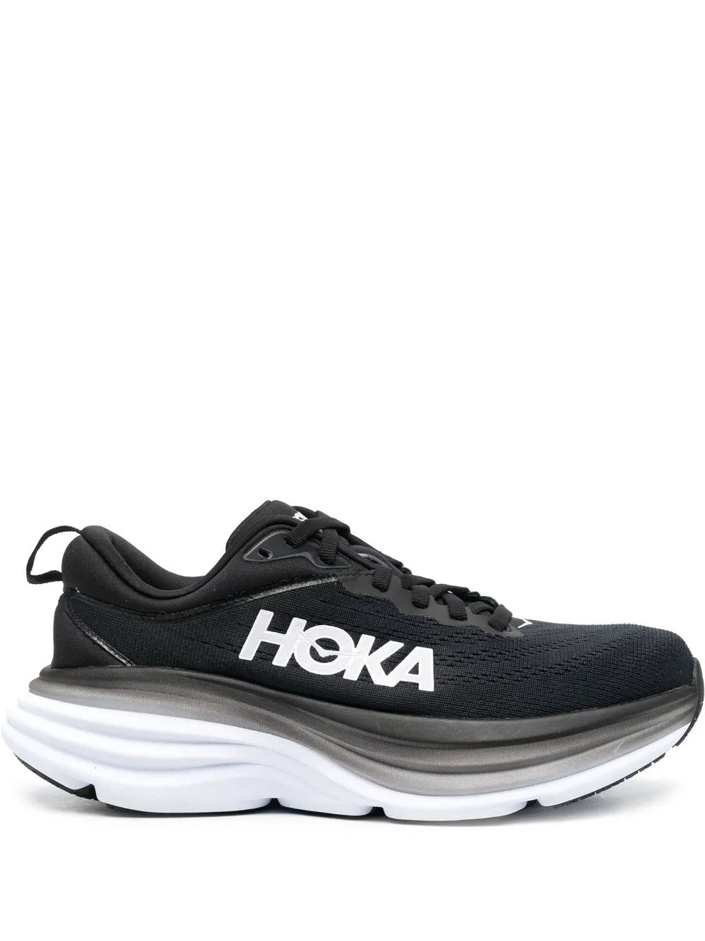 Black lace-up low-top running shoe with cushioned white sole, side view