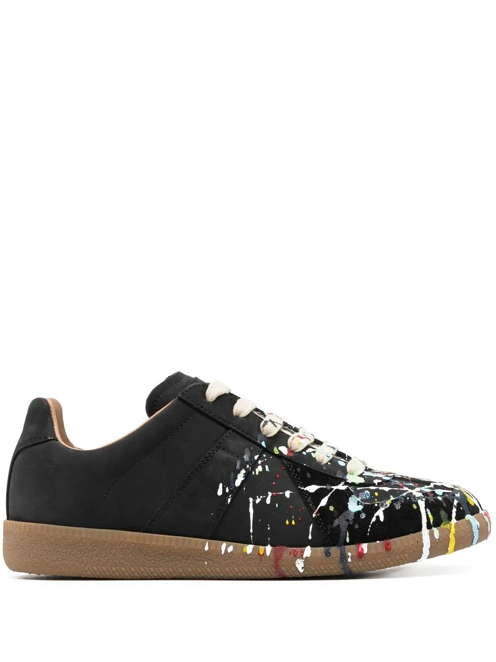 Black low-top sneakers with colorful paint splatter, tan rubber sole, lace-up front