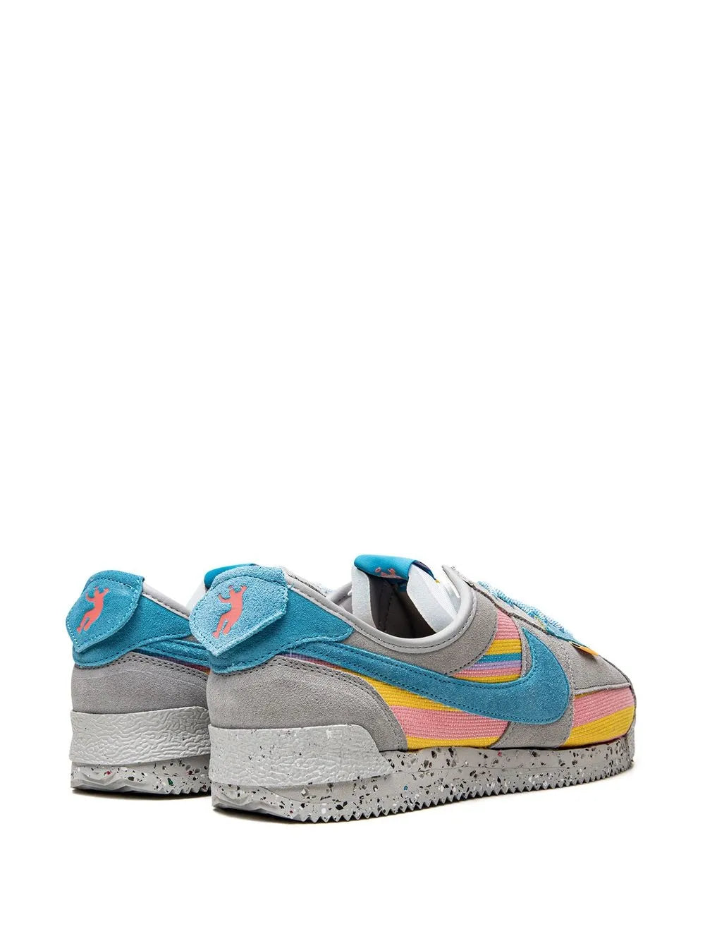 Grey low-top sneakers, teal heel tab and multicolor side panels, rear view