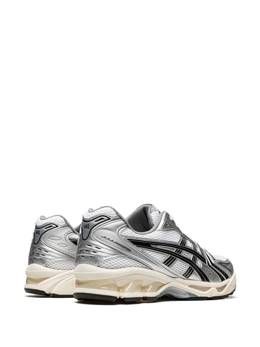 Pair of silver/white ASICS running sneakers with black stripes and cream midsoles