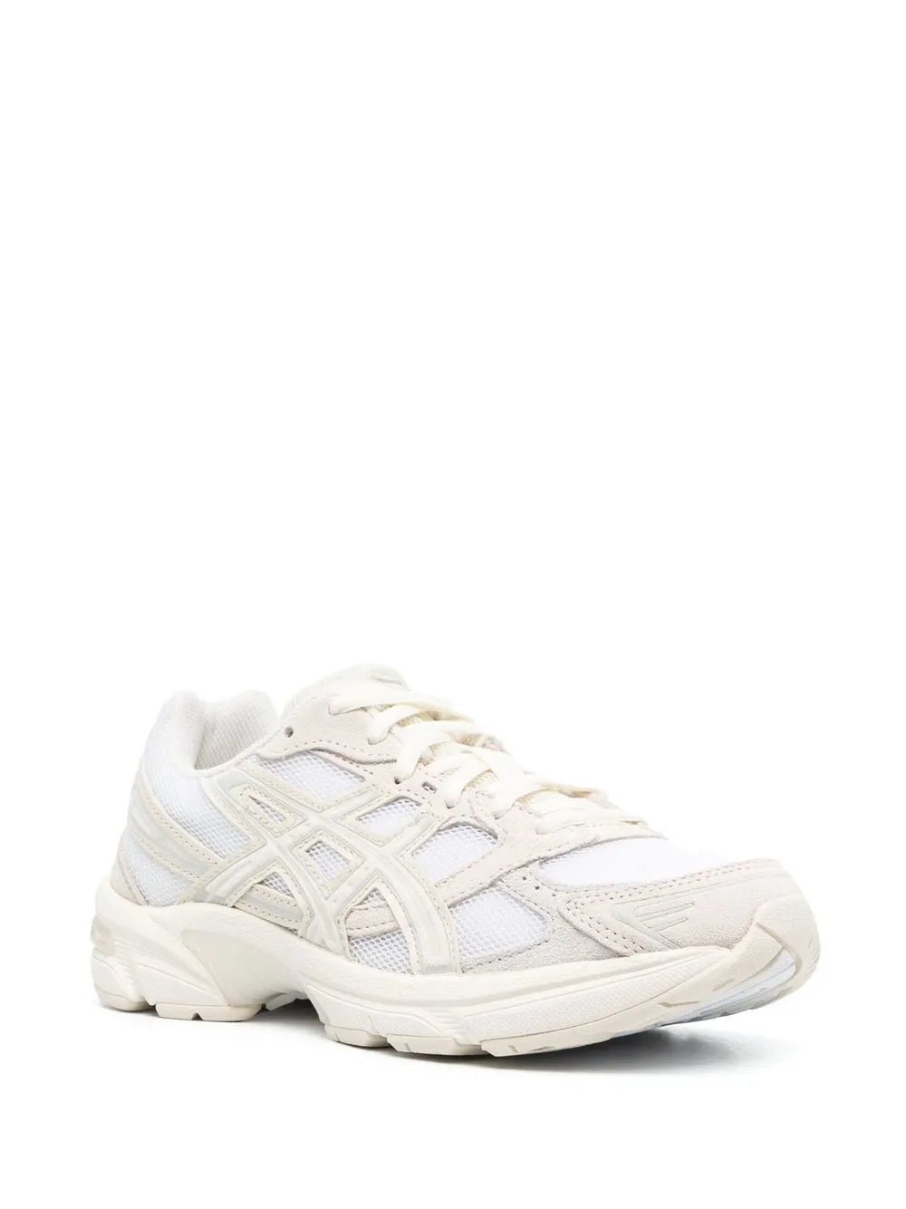 Low-top lace-up sneakers in cream and white with textured overlays and cushioned sole
