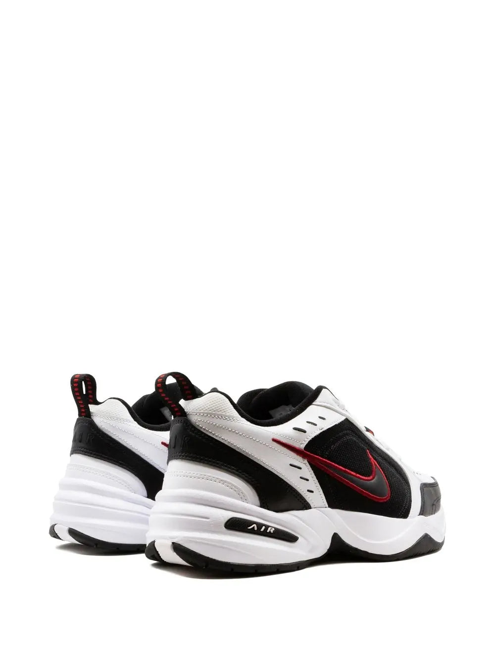 Nike Air Monarch IV sneaker heel view with black and white panels, red logo