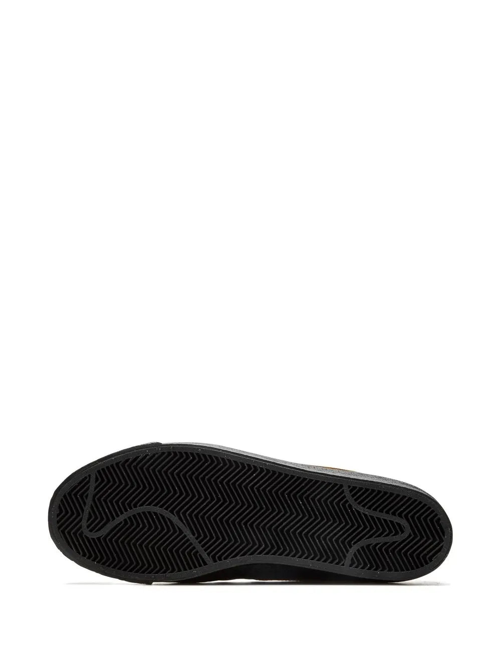 Black rubber outsole with zigzag tread pattern