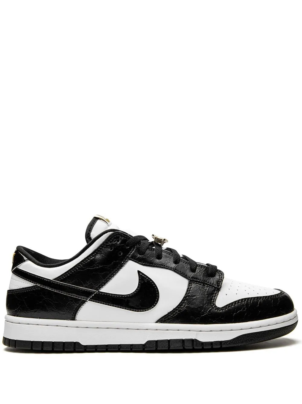 Black and white low-top leather sneaker with Nike swoosh and lace-up closure