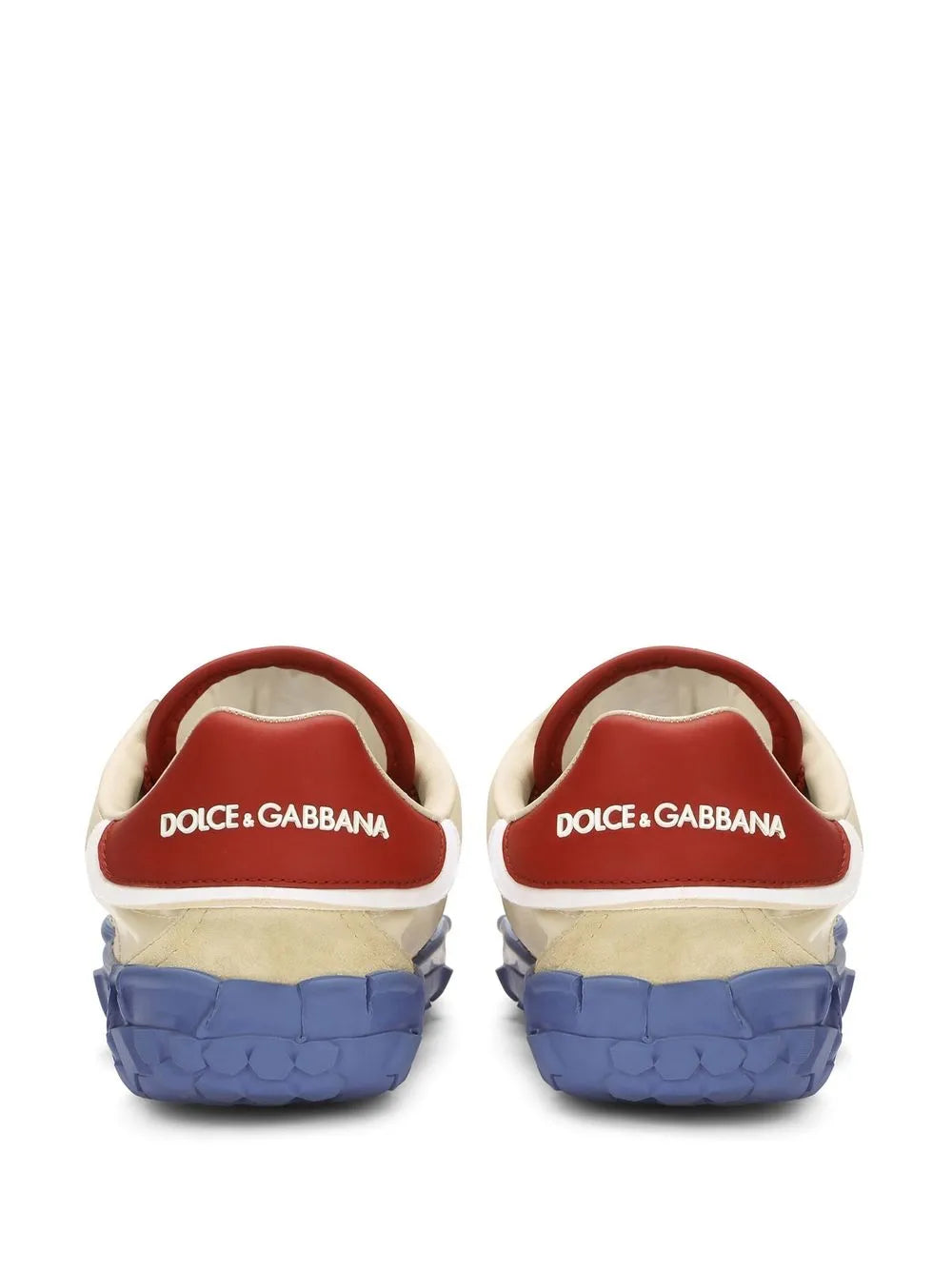 Low-top sneakers with back logo, cream heel with red trim and blue sole.