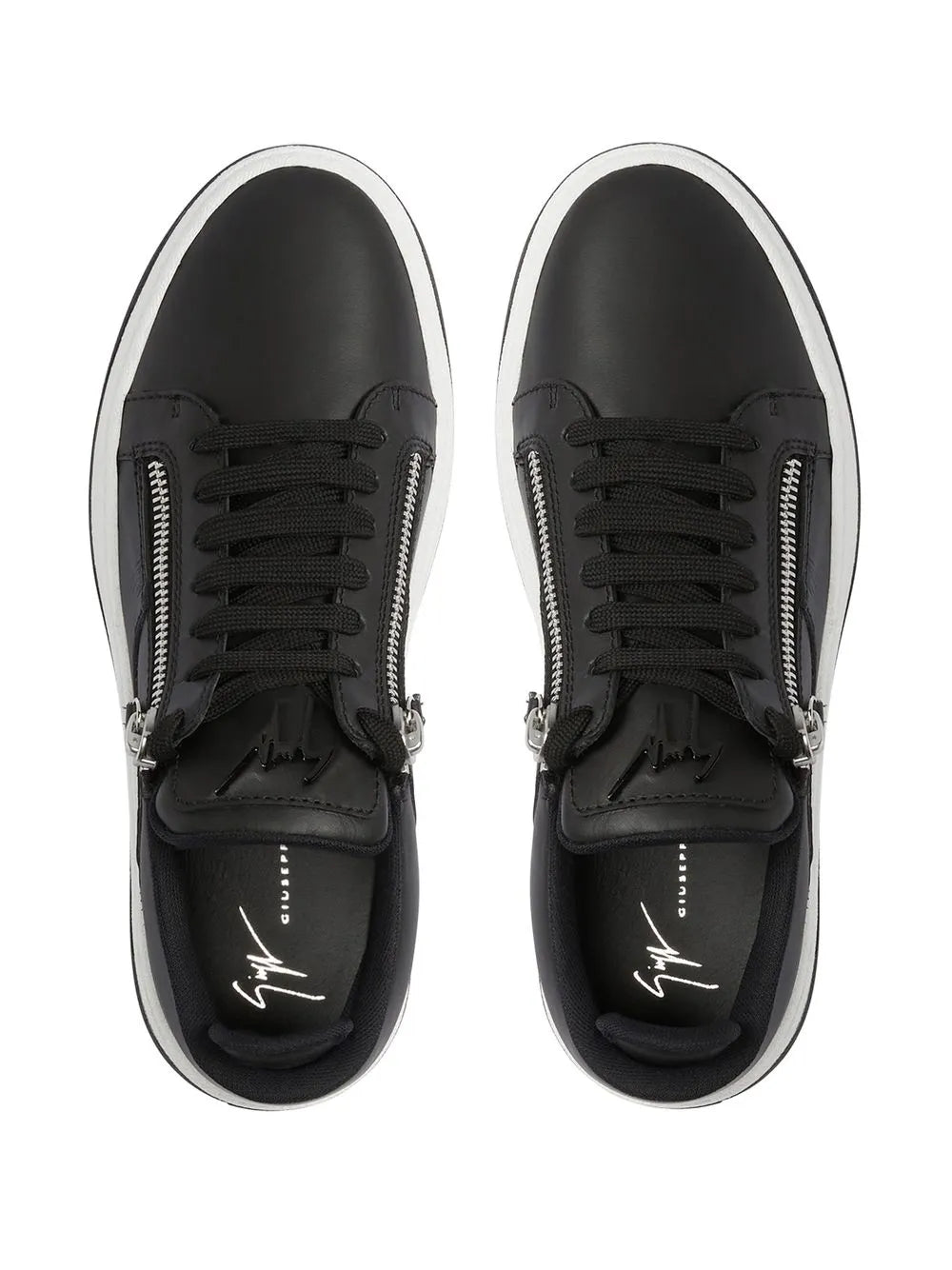 Black low-top sneakers showing lace-up front and dual zipper hardware
