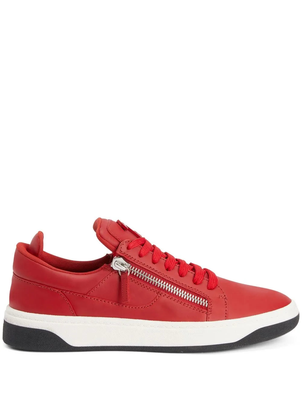 Red low-top sneakers with double zippers, red laces, and white rubber sole