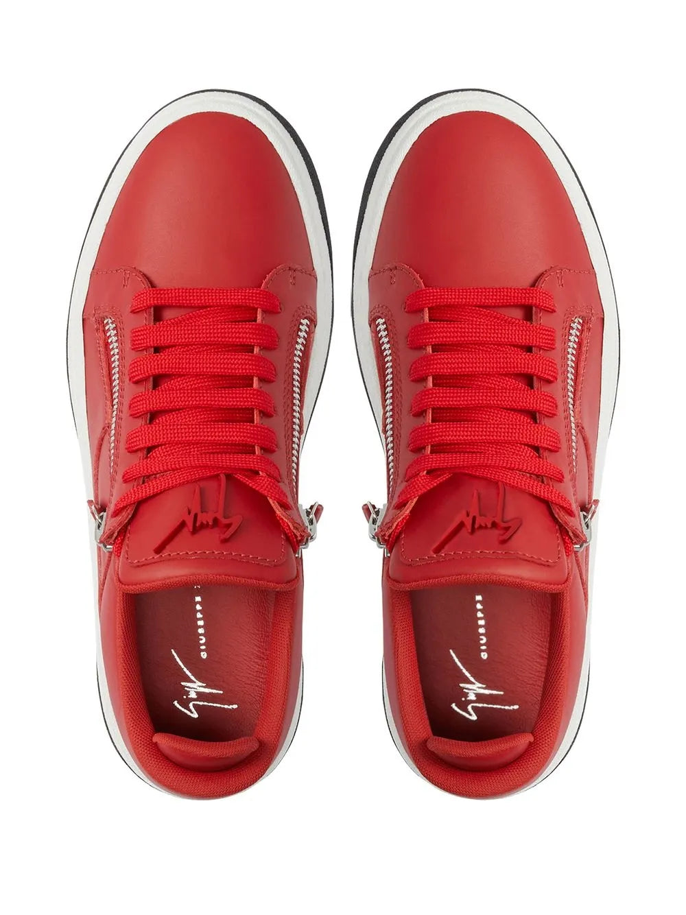 Red low-top sneakers top view with red laces, double zippers, and white rubber trim
