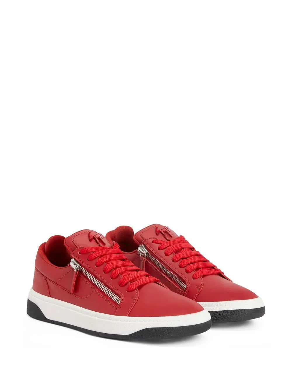 Pair of red low-top sneakers with double zippers and red lace-up front