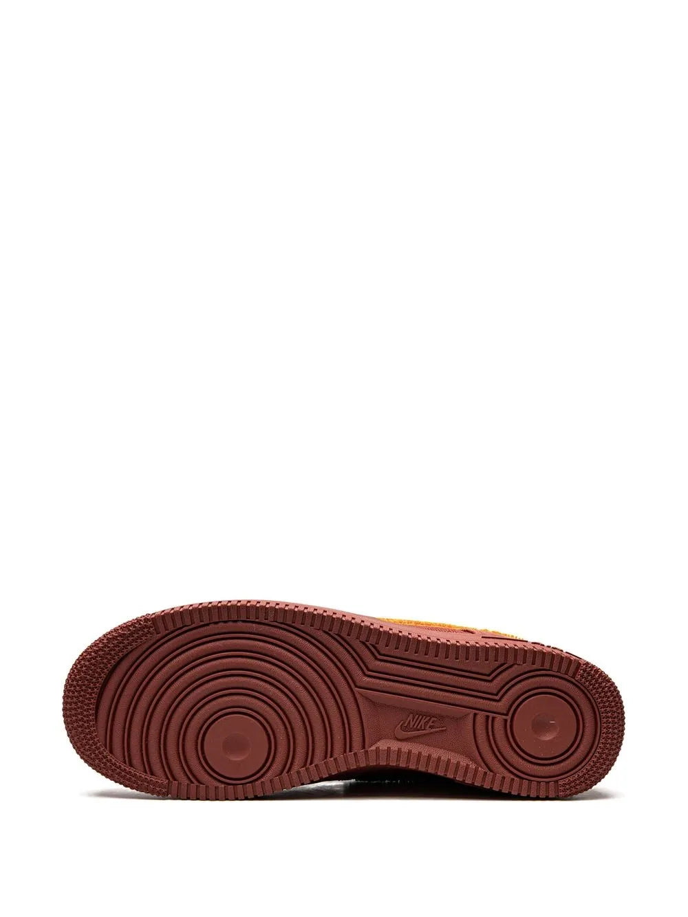 Red rubber outsole with circular traction pattern for low-top sneakers