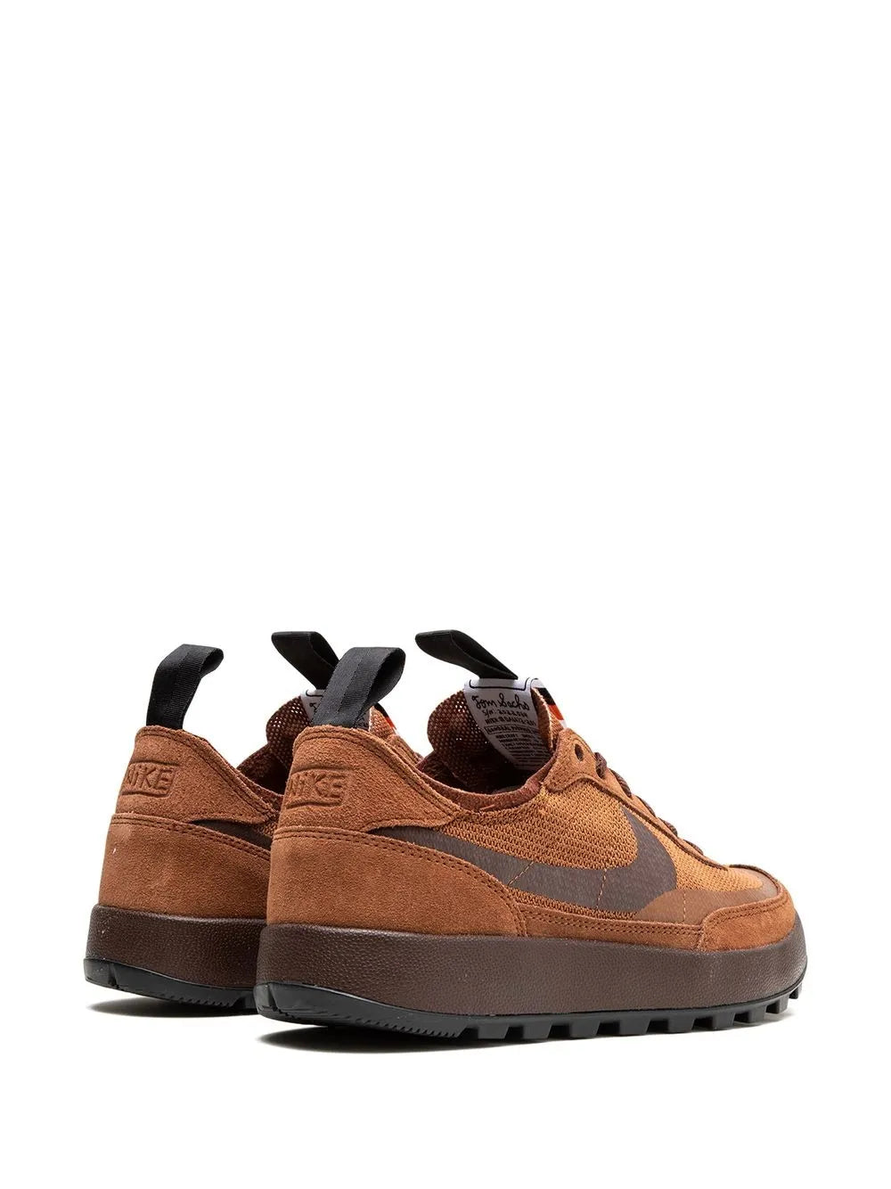Brown Nike sneakers with fabric upper, lace-up front, heel pull tab and rubber sole