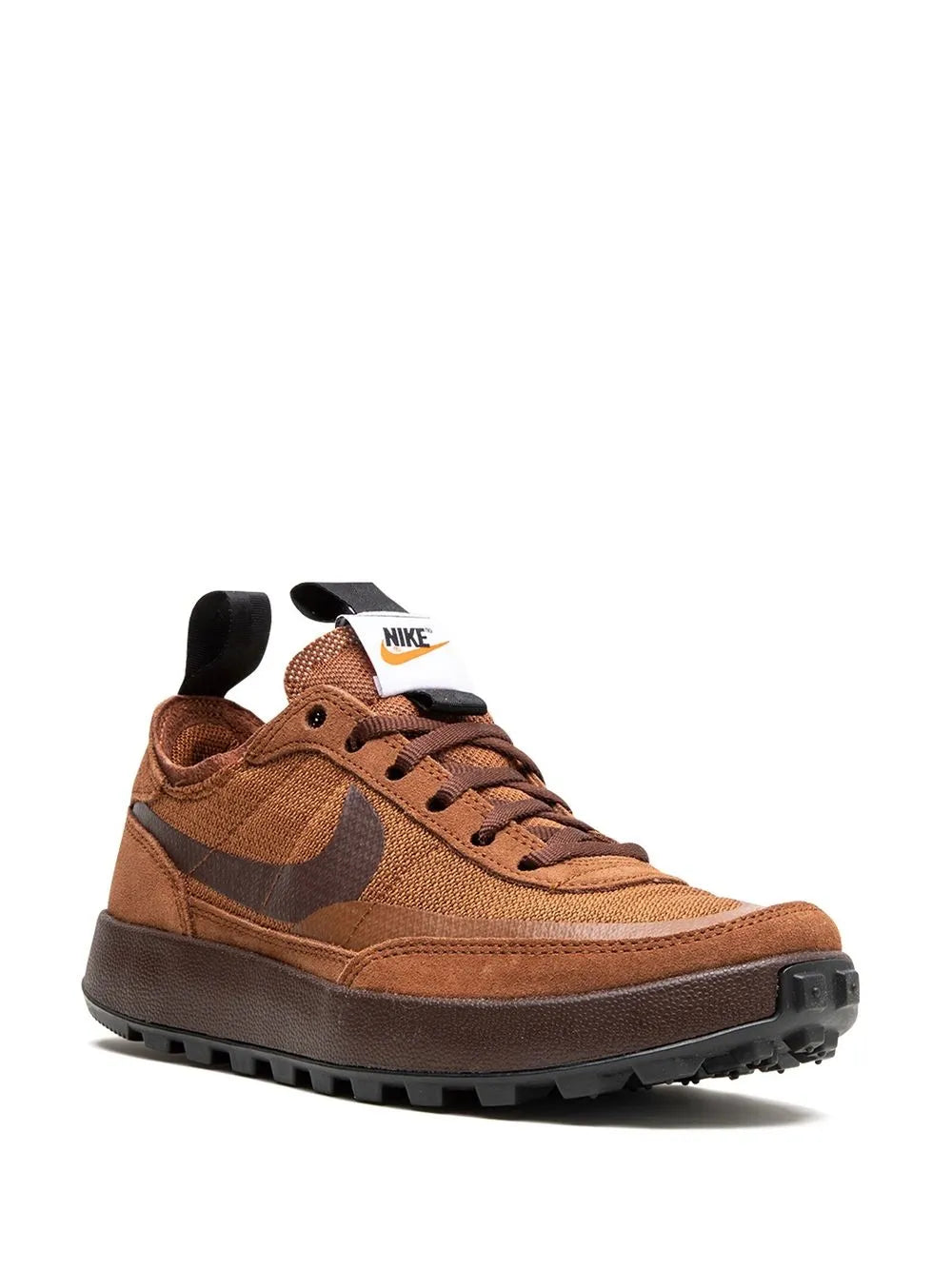 Brown Nike sneakers with lace-up closure, fabric upper, tongue logo patch