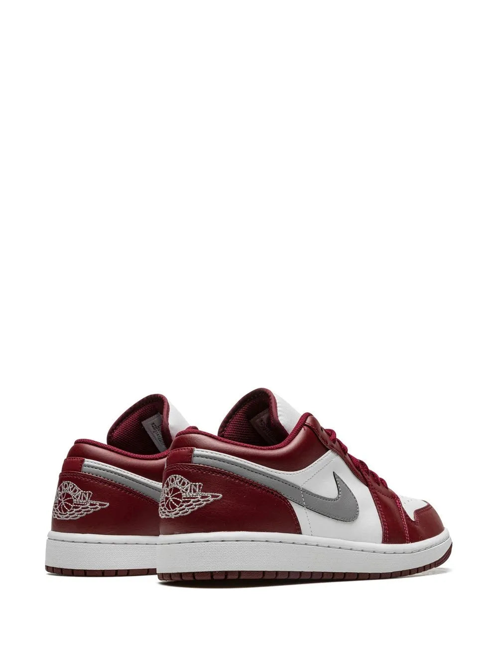Low-top sneaker heel and side with burgundy panels, white midsole, and silver swoosh
