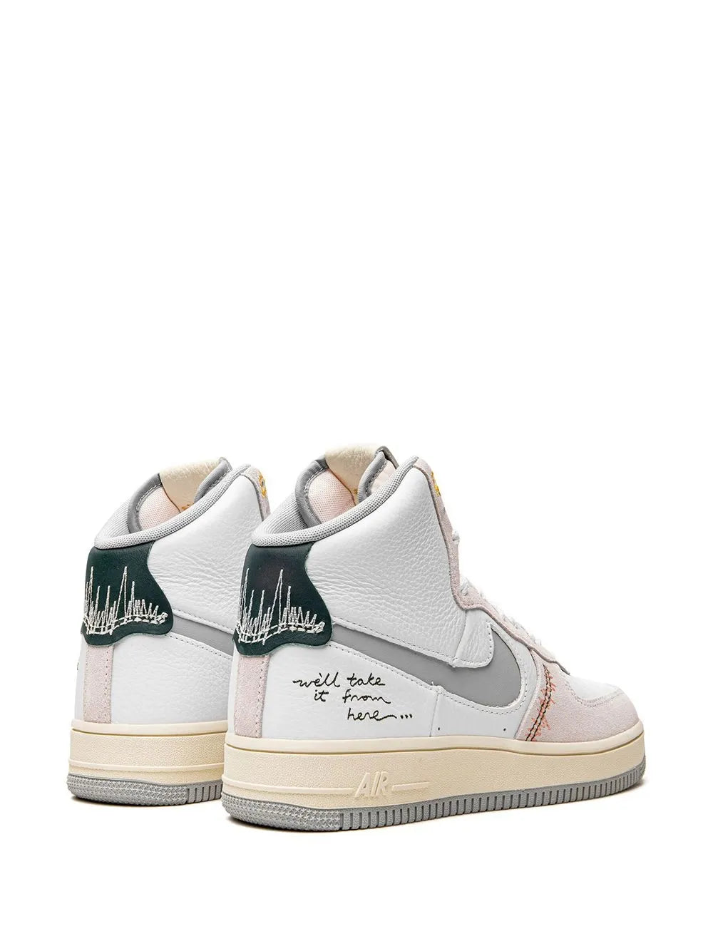 Pair of white Nike high-top sneakers with pink lining and green heel detail